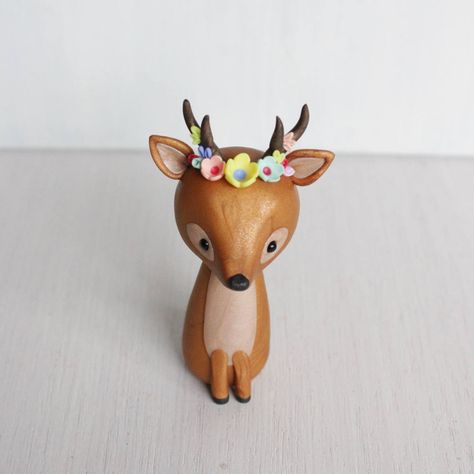 "This deer figurine is hand sculpted in polymer clay with shimmery mica mineral powder for subtle shine and elegant marble effect. This boho style sweet little deer has it's head and antlers adorned with flowers. The deer sculpture would be a perfect stylish woodland cake topper or a gift for a bohemian girl! Made to order, the figurine stands 3.25\" tall. The flower colours can be changed, please leave me details in the message the checkout I accept custom orders, don't hesitate to contact me i Clay Art For Kids, Woodland Cake Topper, Deer Sculpture, Molding Ideas, Woodland Cake, Polymer Clay Ornaments, Sculpey Clay, Polymer Clay Animals, Polymer Crafts