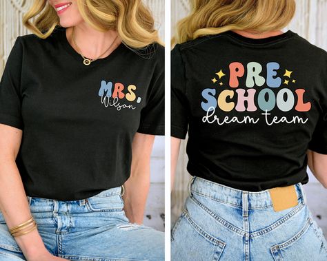 You will have the most stylish teacher team in the school with these shirts! This is also a great gift for a new teacher.  Leave the name you would like in the box provided SIZE UP 1-2 SIZES FOR THAT OVERSIZED LOOK   Thanks so much for shopping with me! Please message me with any questions you may have! I am always available to help :) Also, I would love to feature you on our insta if you want to tag me @poppyroseclothing    PRODUCTION TIME: 1-3 business days    SHIPPING TIME: 2-5 business days   PRODUCT DESCRIPTION: Bella Canvas Unisex T-shirt Super soft cotton and excellent quality print makes. 100% Soft cotton (fibre content may vary for different colors) Light fabric (4.2 oz/yd² (142 g/m Runs true to size CARE INSTRUCTION: Machine wash: cold,  Tumble dry: low heat, do not iron directly Preschool Teacher Tshirt, Preschool Svg Teacher, Prek Teacher Shirt, Tshirt Teacher Outfits, Teacher Name Shirt, Preschool T Shirts For Teachers, Preschool Shirt Ideas, Preschool Teacher Tshirt Ideas, Prek Teacher Shirts Designs