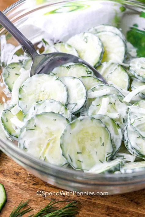 My family thinks this creamy cucumber salad recipe is the best. It is made with crisp cucumbers and onions and tossed in a creamy sour cream, mayo, and fresh dill. This easy salad comes together in minutes and is the perfect side dish for your summer picnic, barbecue or potluck!  #spendwithpennies #cucumbersalad #summerstaple #salad #cucumberrecipe #creamysalad Creamy Cucumber Tomato Salad, Fruit Salad With Pudding, Easy Cucumber Salad, Vinegar Sauce, Cucumber Avocado Salad, Creamy Cucumber Salad, Resep Salad, Cucumbers And Onions, Small Cucumber