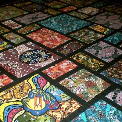 Quilt using Aboriginal fabrics Aboriginal Quilts, Australian Quilts, Creative Quilts, Aboriginal Fabric, Layer Cake Quilt Patterns, Asian Quilts, Panel Quilt Patterns, Aboriginal Patterns, Aboriginal Dot Painting