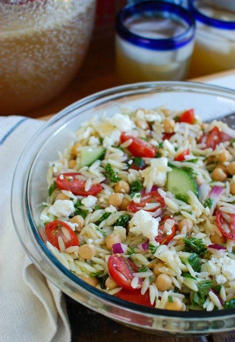 Summer Orzo Pasta Salad is a great addition to any summer get together! This salad mixes together orzo pasta, chickpeas, feta cheese, crisp summer vegetables, fresh herbs and is topped with a light vinaigrette. Your guests are sure to love this one! // A Cedar Spoon Salad With Orzo, Orzo Feta, Summer Orzo, Orzo Pasta Salad Recipe, Summer Pasta Salad Recipes, Feta Pasta Salad, Pastas Recipes, Healthy Pasta Salad, Orzo Pasta Salad