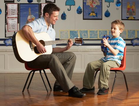 Male Teacher Playing Guitar With Pupil In Classroo. M Having Fun , #AFFILIATE, #Playing, #Teacher, #Male, #Guitar, #Fun #ad Male Teacher, Fun Image, Male Photography, Playing Guitar, Having Fun, Stock Photography, Photo Image, Guitar, Stock Photos