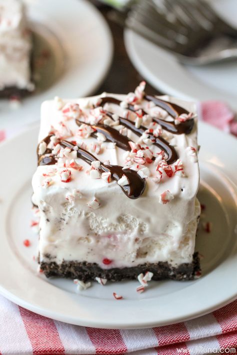 Frozen Peppermint Delight - a simple, festive and delicious holiday dessert with an Oreo crust, peppermint ice cream filling and topped with cool whip, chocolate syrup and candy cane pieces. Peppermint Ice Cream Dessert, Favorite Christmas Desserts, Peppermint Dessert, Christmas Ice Cream, Delicious Holiday Desserts, Peppermint Recipes, Holiday Desserts Christmas, Peppermint Ice Cream, Desserts Christmas