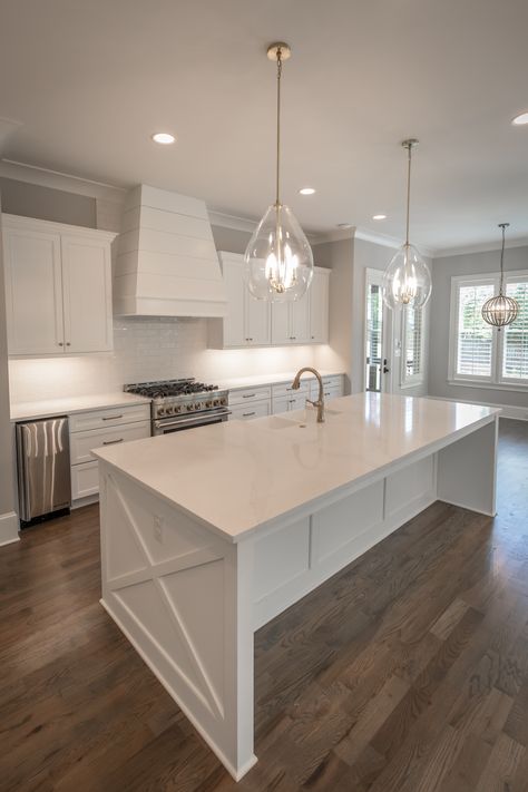 Pristine white kitchen with brass hardware and finishes Modern Kitchen Design White Shaker Cabinets, Kitchen Small White Cabinets, Farmhouse Kitchen Island White, Kitchen Interior Gold And White, White Countertops White Cabinets Kitchen, All White Shaker Kitchen, White And Bright Kitchen, White Kitchen Gold Hardware Stainless Steel Appliances, Modern White Kitchen Design With Island