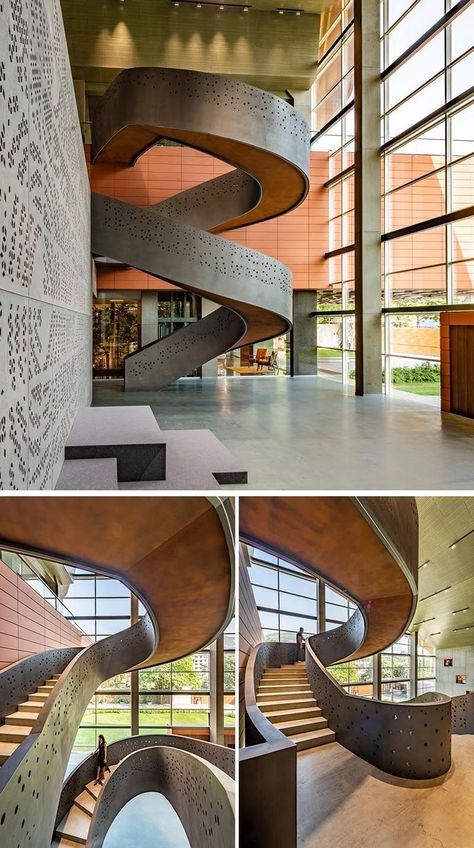 They chose to add interest and character to the space by including a series of perforated surfaces into the design. This staircase is one of them. The perforations definitely help it stand out but to be fair the grand proportions and overall design are impressive on their own. Stair Sculpture, Grand Spiral Staircase, Circle Stairs, Sanjay Puri Architects, Sanjay Puri, Workplace Interior, Artistic Interior, Round Stairs, Spiral Stairs Design