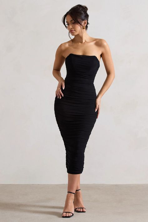 Turn your attention toNylah, our latest lavish midi dress. Crafted in a classic black shade of our signature stretch jersey, this fully ruched piece is transcended by a soft mesh overlay and sculpting bodycon silhouette. Defined by a boned corset bodice and lace up back to enhance all your feminine features, try styling this strapless midi withSadieto add a touch of sparkle.  Features  - Premium stretch jersey - Mesh overlay - Fully ruched - Bodycon fit  - Curved bandeau neckline  - Boned corset bodice - Lace up back - Split hemline  - Midi length   Sizing & Fit  Model is 5'8 and wears UK size 8 / US size 4  Product Information     Double layered with good stretch  Premium jersey & mesh in Black (92% Polyester, 8% Elastane)  120cm total length  SKU:CL133268002 Black Bandeau Midi Dress, Black Ruched Midi Dress, Feminine Features, Ruffle Bodycon Dress, Velvet Prom Dress, Ruffle Bodycon, Corset Midi Dress, Black Bandeau, Black Dress Prom