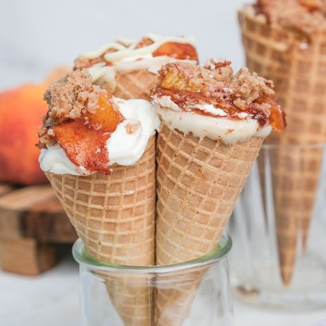 Peach Cobbler Cheesecake Cone Recipe Waffle Cone Filling Ideas, Peach Cobbler Cones Recipe, No Bake Cheesecake Cones, Waffle Cone Cheesecake Recipe, Waffle Cone Cheesecake, Peach Cobbler Stuffed Cones, Cheesecake Filled Waffle Cones, Waffle Cone Desserts, Peach Cobbler Cheesecake Cones