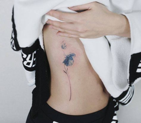 Blue poppy tattoo on the right ribcage. Blue Poppy Flower Tattoo, Blue Poppy Tattoo, Flower Tattoo Ribs, Small Poppy Flower Tattoo, Small Nature Tattoo, Blue Flower Tattoos, Tattoo Ribs, Poppy Flower Tattoo, Tiny Flower Tattoos