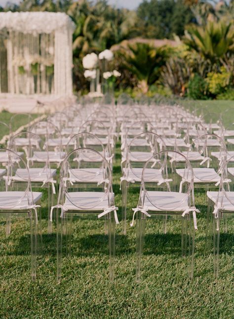 Ghost chairs brought such a stylish touch to the lush green lawn at a @Four Seasons Resort the Biltmore Santa Barbara garden wedding. Ghost Chair Wedding, Jeff Leatham, Chairs Wedding, Clear Chairs, Mindy Weiss, Plastic Chairs, Ceremony Chairs, Ghost Chairs, Ceremony Design