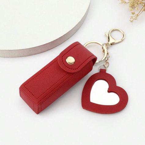 Size: Length: 9cm Width: 2,5cm Introducing our Keychain for your Lipstick or beauty accessories. The perfect blend of fashion and functionality. This compact accessory is designed to keep your favorite lipstick always within reach, ensuring you never have to dig through your bag again. * Sleek Design: Crafted from high-quality materials, our keychain boasts a chic and modern look, available in various colors to match any outfit or bag. * Secure Holder: The lipstick compartment is designed to sec Multicolor Makeup, Heart Shaped Mirror, Valentine Gifts For Girls, Shaped Mirror, Portable Bag, Lipstick Holder, Heart Bag, Cool Gifts For Women, Bird In Bag