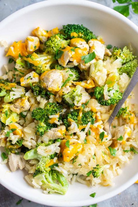 Chicken, rice, and broccoli are simmered in on the stove for the perfect casserole-style dinner. It's easy, quick, cheesy, and family-loved! Chicken Rice Broccoli Bowl, Chicken Rice Broccoli Casserole, Chicken Vegetable Rice, Chicken Broccoli Rice Cheese Casserole, Chicken Rice Broccoli, Riced Broccoli Recipes, Broccoli Cheese Rice, Healthy Brown Rice, Rice Bowls Healthy