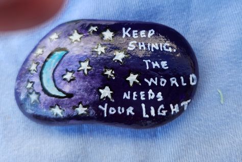 I painted this river rock with a moon and stars. It's a deep purple sky with a moon and stars. I painted the words, "Keep Smiling.  The World Needs Your Light".  This rock is approximating 3 inches by 1.5 inches by 0.5 inch It is painted with acrylic paint and sprayed with a clear coat.  I have been a retired bookkeeper for the last five years and enjoy painting and creating. I don't know why rocks speak to me but they do.  I have painted for myself and family for years and I am now enjoying that other people besides family enjoy my artwork.  If you have an idea for a  custom painting on a rock please contact me and I will do my best to put your idea on a rock for you. If this item does not meet your expectations it may be returned for a full refund. Painted Rocks Christian Theme, Night Sky Painted Rocks, You Rock Rock Painting, Uplifting Painted Rocks, Rock Concert Painted Rocks, The Last Five Years, Last Five Years, Painted River Rocks, Rock Quotes