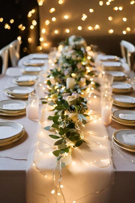 Dining table with fairy light runner Fairy Light Table Decorations, Light Table Centerpieces, Christmas Light Wedding Decor, Twinkle Light Centerpiece Wedding, Simple Wedding Centerpieces Fairy Lights, Wedding Centerpieces Without Candles, Table Lights Wedding, Fairy Lights Wedding Reception Table, Fairy Light Table Numbers