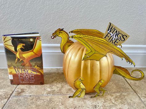 Book: Wings of Fire Character: Princess Sunny (dragon). Wings Of Fire Graphic Novel Pfp, Dragon Painted Pumpkin, Wings Of Fire Pumpkin, Dragon Pumpkin Decorating, Pumpkin Dragon, Dragon Pumpkin, Wings Of Fire Pumpkin Carving, Wings Of Fire Book Covers, Wings Of Fire Books In Order