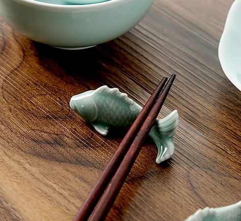 Elevate your holiday gifting with a beautifully crafted Ceramic Fish Chopstick Holder, the perfect present for the sushi aficionado, culinary enthusiast, or anyone who appreciates the art of dining. This exquisite gift combines functionality and aesthetic appeal, making it an ideal Christmas gift for your loved ones. As a Christmas gift, the Ceramic Fish Chopstick Holder offers a unique and thoughtful option. It's a versatile present that suits various tastes and occasions, making it an excellen Ceramic Kitchen Ideas, Fish Chopstick Rest, Cute Chopstick Holders, Pottery Chopstick Holder, Ceramic Chopstick Rest, Chopstick Holder Ceramics, Chopstick Rest Ceramics, Clay Chopstick Rest, Ceramic Fish Sculpture