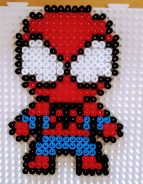 Spiderman beads #perleshama Peeler Bead Spiderman, Spiderman Beads Pattern, Perler Beads Ideas Spiderman, Pyssla Ideas Spiderman, Spiderman Melty Beads, Spiderman Bead Pattern, Iron Beads Spiderman, Spiderman Perler Beads Small, Spiderman Pearl Beads