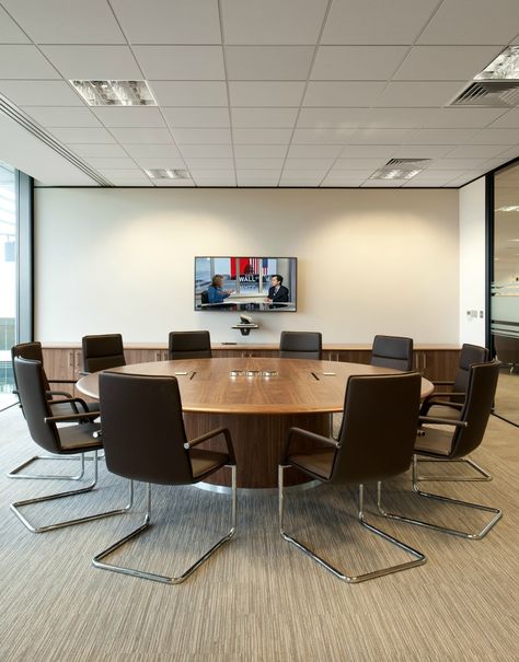 Board Room >> Circular Meeting Room Table >> This round wooden table in the boardroom at Amey creates a perfect collaborative space for colleagues. People often prefer the increased eye-contact you get when seated at a round table, and the more egalitarian nature of not having someone sitting at the head of the table. See more of the collaboration areas and meeting spaces we created at Amey on our website... Conference Room Round Table, Circular Office Table, Board Room Design Office, Round Table Meeting Room, Meeting Room Round Table, Round Meeting Table Office, Office Round Table, Round Table Office, Board Room Design