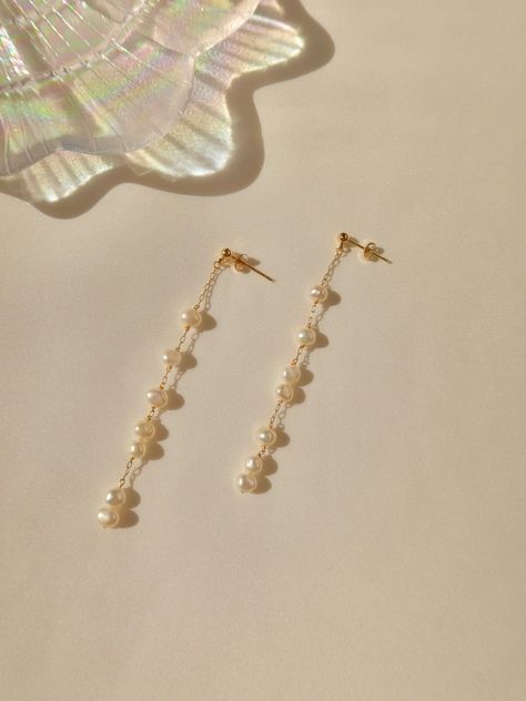 [SponsoredPost] These Rain Drop Earrings Are Uniquely Handmade Featuring Baroque Pearls Distributed Unevenly On The 14K Gold Filled Dainty Chain Which Made The Theme Of Rain Dropping. Each Of The Baroque Peal Is Handpicked And Handcrafted With Different Intervals On The Chain. Super Dainty And Elegant Long Pearl Earring For Various Occasion. #pearlearringshandmade Gold And Pearl Dangle Earrings, Dangly Pearl Earrings Wedding, Asymmetrical Earrings Handmade, Gold Dangly Earrings, Dangle Pearl Earrings Wedding, Dangly Pearl Earrings, Dangling Pearl Earrings, Pearl Long Earrings, Gold Long Earrings