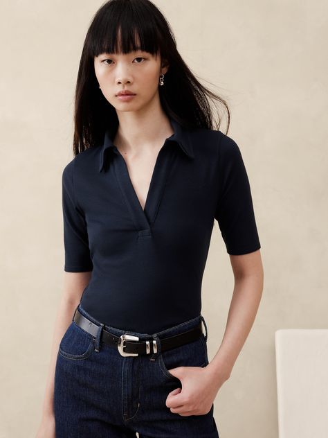 This ribbed polo is cut in an extra-long length, crafted from a cotton and modal blend, giving it an even-softer handfeel.  Fitted.  Extra long.  Polo collar.  Straight hem.  Fitted.  Elbow sleeves.  Tunic length.  Model: Size S, 5'10" (178cm). Work Polo Shirt Outfit Women, Polo Shirt Aesthetic, Polo Outfits For Women, Female Lawyer Fashion, Polo Shirt Outfit Women's, Work Polo Shirts, Polo Shirt Outfits, Polo Outfit, Polo Women