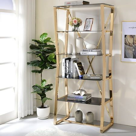 Glamorize your bedroom or home office with the rich sophistication of this contemporary gold bookcase. Boasting five shelves perfect for everything from books to awards, to personal treasures, this bookcase features tempered black glass for a cool, modern appearance. The frame of the bookcase features a metallic finish over steel construction, with hourglass shaped open sides and a crossing X-brace across the back for added stability. About Furniture of America Furniture of America is proud to b Bookcase Overstock, Glass Bookcase, 4 Shelf Bookcase, Contemporary Bookcase, Tempered Glass Shelves, Shelf Bookcase, Etagere Bookcase, Furniture Market, Glass Shelf