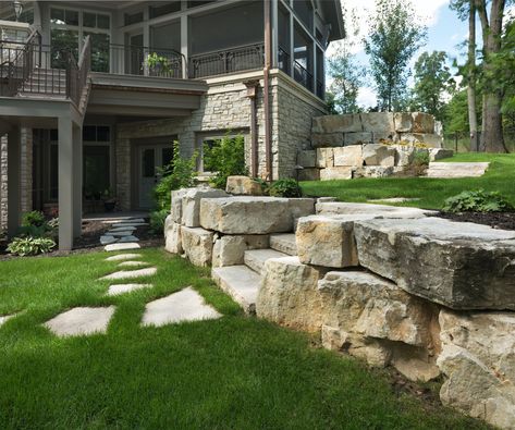 Boulder Retaining Wall Landscape Design MN | Concrete Paver Patio Modern Stone Retaining Wall, Large Stone Retaining Wall, Stone Boulder Retaining Wall, Backyard With Levels Retaining Walls, Stamped Patio With Retaining Wall, Retaining Wall Large Stones, Pool Retaining Wall, Armour Stone Retaining Wall, Concrete Paver Patio