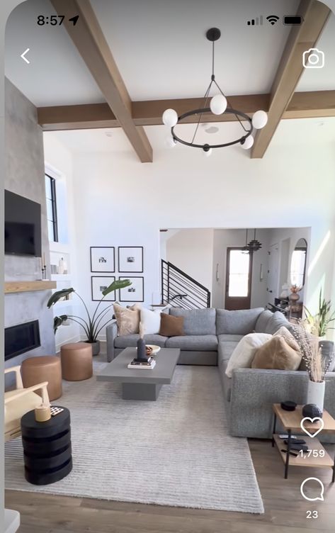 Dark Grey Neutral Living Room, White Brown Gray Living Room, Light Grey Living Room Ideas Modern, Earthy Living Room Grey Sofa, Couch Next To Stairs, Styling Dark Gray Couch, Grey Couch Organic Modern Living Room, Black Grey White Brown Living Room, Color Sofas Ideas