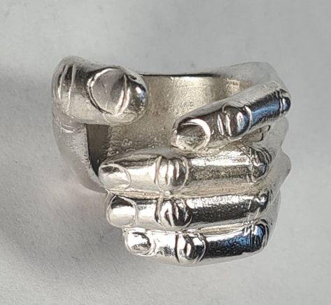 **Please note that we dispatch on Tuesdays unless special delivery express option is paid for** Sterling silver 'hand ring'. Original design carved in wax then lost wax cast into sterling silver.  Very large piece which weighs approximately 42g in silver.  A significant size adjustment may alter the appearance. PLEASE NOTE THE PHOTO ON THE WOMAN IN THE REVIEW IS A SIZE J AND TO MAKE IT LOOK LIKE THAT AT A LARGER SIZE WILL REQUIRE A £40 SUPPLEMENT. Please contact us to discuss.  First class recor Wax Cast Rings, Lost Wax Ring, Lost Wax Casting Rings, Hand Shaped Ring, Wax Carved Ring, Wax Jewelry, Lost Wax Jewelry, Space Rings, Carved Ring