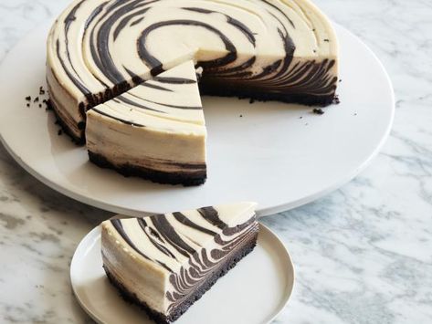 Take your cheesecake to the next level with chocolate and vanilla layers that swirl into a zebra-like pattern. The crunchy chocolate cookie crust is just the partner for the creamy filling. Chocolate Vanilla Swirl Cheesecake, Choc Cheesecake, Chocolate Swirl Cheesecake, Chocolate Cookie Crust, Chocolate Wafer Cookies, Crunchy Chocolate, Tart Cherry Juice, Cheesecake Pie, Zebra Cake