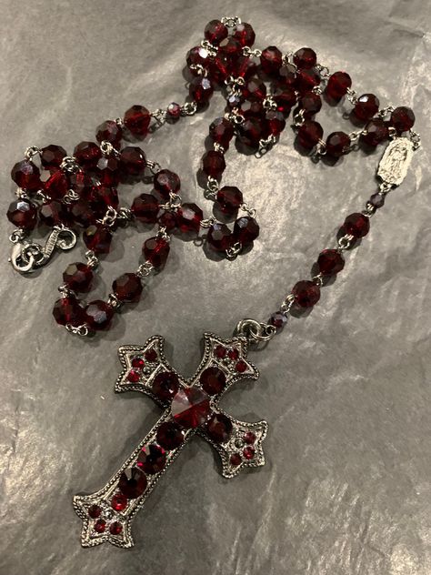 Black plated,  beautiful ruby red Siam crystal rosary.  It does have a clasp so that you can wear it in many ways, including a layered look. The cross pendant like all of my rosary necklaces has crystals on both sides so if it turns you see crystals on either side. Also, all my jewelry is hypoallergenic. Red Rosary, Rosary Style Necklace, Red Pomegranate, Rosary Necklace, Red Jewelry, Jewelry Lookbook, Funky Jewelry, Cross Jewelry, Fantasy Jewelry