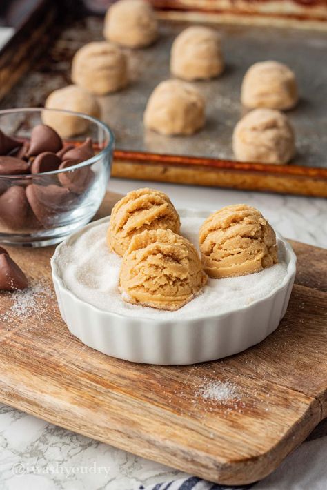 These Peanut Butter Kiss Cookies are easy to make, with a chewy peanut butter base and Hershey's Kisses in the middle! Kiss Cookie Recipe, Peanut Butter Kiss, Peanut Butter Kiss Cookies, Kiss Cookies, Hershey's Kisses, Hershey Kisses, Baking Sheet, In The Middle, Cookie Dough