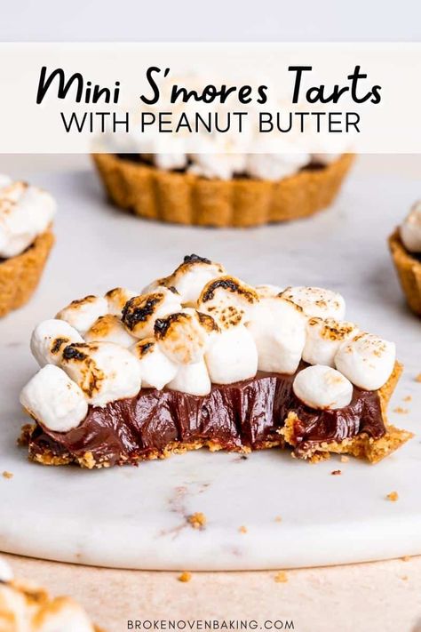 An easy and delicious no bake dessert! These mini s'mores tarts have a peanut butter graham cracker crust, chocolate ganache filling and toasted marshmallows on top! Grab the full recipe on brokenovenbaking.com. Smores Tart, Camping Treats, Peanut Butter Smores, Chocolate Smores, Gluten Free Graham Crackers, Hershey's Chocolate, Cracker Crust, Peanut Butter Filling, Mini Tart