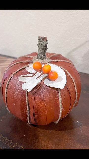 Michelle on Instagram: "A @dollartree faux leather pumpkin - it’s absolutely beautiful! It’s inspired by one I saw created by @gleespen_designs. I had the styrofoam pumpkin left over from last year and I had the faux leather in my craft stash. I cut the faux leather into ~ 1.25” strips & used hot glue to attach each strip to the bottom. The strips were long for the height of the pumpkin, so I cut off the excess and tucked the rest into the hole on top. I found a stick in the backyard & cu Leather Pumpkin, Fall Arrangements, Craft Stash, Fall Decor Diy, A Stick, Dollar Tree Diy, Leather Diy, Pumpkin Decorating, Hot Glue