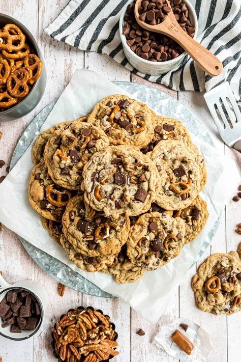 Overhead shot of the cookies stacked on a round plate lined with parchment paper. Panera Kitchen Sink Cookie Recipe, Kitchen Sink Cookies Panera, Kitchen Sink Cookies Recipe, Panera Copycat, Sink Cookies, Kitchen Sink Cookies, Copycat Panera, Chewy Caramel, Panera Bread