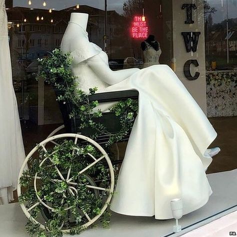 BBC News on Instagram: “A bridal shop has been praised for putting one of its wedding dresses on a mannequin seated in a wheelchair. A photo of the shop window…” Wheelchair Wedding, Wheelchair Photography, Bridal Chair, Reference Pose, Mobility Aids, Dream Wedding Ideas, Shop Window, Bridal Shop, Bbc News