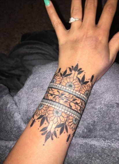 30+ Bold & Beautiful Tribal Tattoos For Women | Spiritustattoo.com Cuff Tattoo Wrist, Wrist Cuff Tattoo, Tato Mandala, Mandala Wrist Tattoo, Wrist Band Tattoo, Wrist Tattoos Girls, Tato Suku, Tattoo Band, Unique Wrist Tattoos