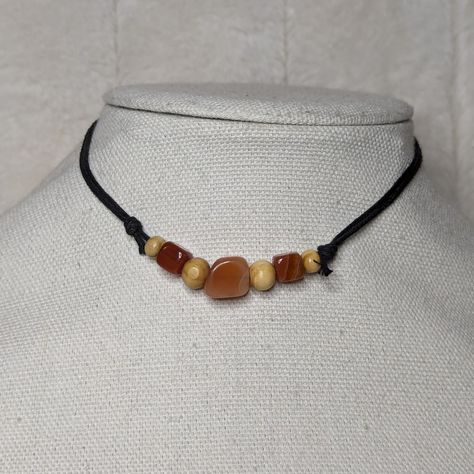 Carnelian Chunk Crystal Stone And Wood Beaded Boho Hippie Adjustable Necklace Comes On An Adjustable Waxed Black Cord Necklace. Necklace Is Adjustable From Approximately 13" To 22". Wood Necklace Pendant, Masculine Jewelry, Homemade Necklaces, Stone And Wood, Black Cord Necklace, Cool Piercings, Jewelry Accessories Ideas, Dope Jewelry, Wood Necklace