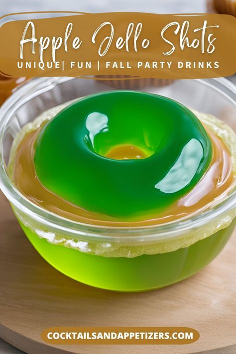 These Caramel Apple Jello shots are made with Crown Royal Apple Whiskey, green apple jello and caramel sauce with a candy ring fun garnish! Easy recipe for jello shots. A favorite jello shot recipe for Fall parties, Christmas party shots or anytime. An alcoholic Fall cocktails and fall drinks recipe favorite. Recipe For Jello Shots, Christmas Party Shots, Caramel Apple Jello Shots, Apple Jello Shots, Fall Party Drinks, Caramel Cocktail, Crown Royal Apple, Crown Royal Whiskey, Crown Royal Drinks