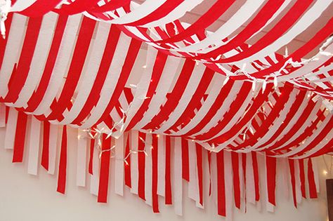 Red white streamer ceiling Candy Cane Photo Booth, Red And White Christmas Party Decor, Candy Cane Christmas Party Decorations, Candy Cane Hallway Decorations, Candy Cane Classroom Decorations, Candy Cane Lane Christmas Decor, Streamer Ceiling, Christmas Circus, Christmas Hallway