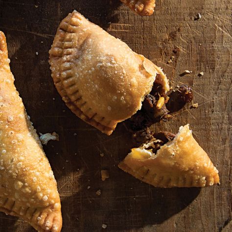 Beef Brisket Picadillo-Stuffed Empanadas Recipe | Saveur Brisket Empanadas, Beef Empanadas, Empanadas Recipe, Braised Beef, Beef Brisket, Fish And Chips, Pine Nuts, Pretzels, Fajitas