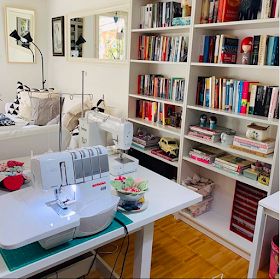 The Itinerant Seamstress: 10 real-life sewing rooms Narrow Sewing Room, Sewing Room Ideas Aesthetic, Sewing Room Storage Ideas Small Spaces, Sewing Room Shelves, Sewing Room Office Combo, Sewing Room Ideas Layout, Sewing Studio Space, Small Sewing Space, Sewing Room Ideas