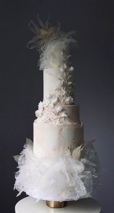 14. Ruffle, Concrete & Magnolia Wedding Cake The “Eternal Elegance Wedding Cake” is a masterpiece that embodies the timeless beauty and grace of a... Lace Cake Designs, 2024 Wedding Cake Trends, Elegant Modern Wedding Cake, Magnolia Wedding Cake, Ethereal Wedding Cake, Cakes 2023, Textured Wedding Cakes, Contemporary Wedding Cakes, Wedding Cake Options