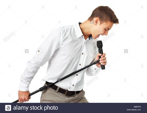 Young man singing into a microphone isolated on white background Stock Photo Man Singing, Singing Microphone, People Poses, White Background Photo, Body Poses, Art Poses, Pose Reference Photo, Drawing Reference Poses, Art Reference Poses