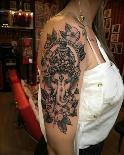 17 Elephant Tattoo Ideas for Women: Graceful and Empowering Designs Black Woman Empowerment Tattoos, Ganesha Tattoo Sleeve, Tattoos Collar Bone, Ganesha Tattoos, Collar Bone Tattoos, Small Inspirational Tattoos, Small Colorful Tattoos, Ganesh Tattoo, Jagua Henna