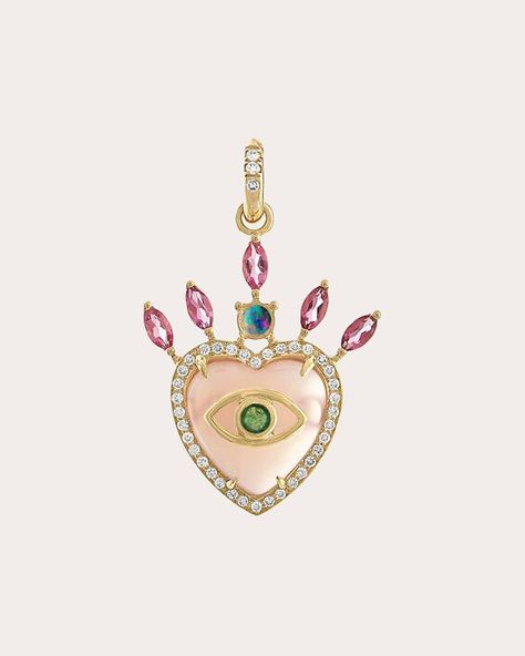 Drawing inspiration from protective talismans, this heart-shaped pendant is carved from a genuine pink opal. The 14-karat gold design is embellished with an evil eye motif, pavé-set diamond halo and marquise-cut pink tourmaline spikes. From Eden Presley's Rock Collection. Chain not included 14k gold, pink opal, pink tourmaline and diamond Carat: 0.25 ctw diamond Diamond color: G-H Diamond clarity: VS1 Polish with soft cloth Made in the USA Measurements Width: 1in Length: 1.5in