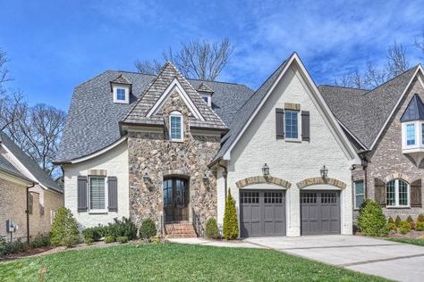 Traditional Home Painted Brick and Stone Accents | HGTV Rendered Brick, Painted Brick House Exterior, Tudor Design, Painted Brick Exteriors, Amazing Kitchens, Painted Brick House, Traditional Style Homes, English Tudor, Exterior Paint Color