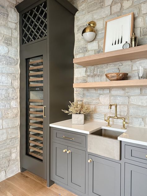 Stone wet bar, moody cabinets, concrete farm sink, industrial brass faucet. Wet Bar Shelves, Pool House Wet Bar, Entry Bar Ideas, Wet Bar With Sink, Bar Sinks Ideas, Wet Bar Inspiration, Wet Bar Sinks And Faucets, Wet Bar Wall, Wet Bar Ideas With Sink