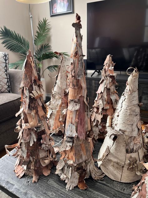 Cone shaped trees made of naturally foraged birch bark from the forests of Nova Scotia. Beautiful for a tabletop or shelf these come in many sizes and each one is uniquely created by hand. A lovely gift or personal decoration.  Variation of colours of the bark is completely natural and makes these even more beautiful. Natural woodsy hues and textures. No one is the same.  Prices and sizes vary.  Size variations may differ by up to -) 2 inches.  Note: Buyer is responsible for any Duty or Customs Birch Christmas Ornaments, Birch Bark Christmas Tree, Woodland Winter Decor, Birch Log Decor Diy Projects, Birch Tree Centerpieces, Birch Christmas Decor, Woodland Christmas Tree Ideas, Birch Bark Crafts Diy, Woodland Christmas Decorations