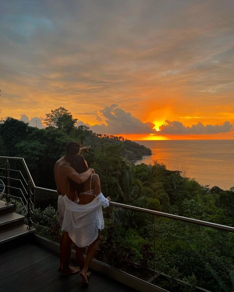 Couple embracing on a private balcony, watching a vibrant sunset over the lush rainforest and ocean at Hotel Makanda in Manuel Antonio, Costa Rica. Costa Rica Proposal, Costa Rica Couple, Lush Rainforest, Costa Rica Honeymoon, Dream Hotel, Costa Rica Hotel, Action Board, Couple Embracing, Manuel Antonio Costa Rica