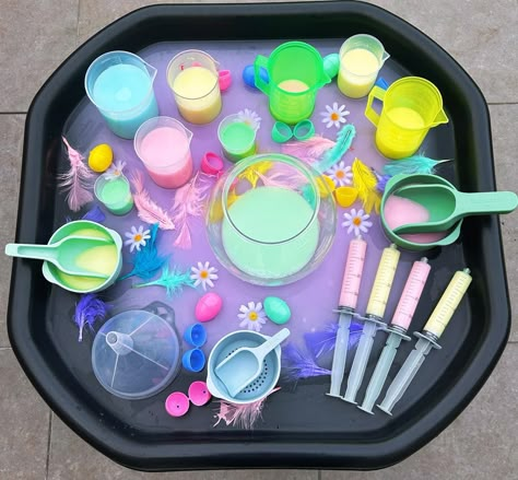 Spring Potions 🐣 - Water play - Creative play - Independent play - Exploring colour mixing - Scooping, pouring and filling containers 🌸 Water is mixed with coloured paint 🌸 White paint is added to make the colours look pastel #tufftray #tufftrays #tufftrayideas #tufftrayactivities #tufftrayfun #waterplay #tuffspot #tuffspotideas #playtray #playtrayideas #sensoryplay #sensoryplayideas #sensoryplayactivities #easteractivity #eyfs #earlyyears #eyfsideas #earlyyearsideas #eytagteam #messy... Messy Play For Preschoolers, Outdoor Eyfs Activities, Messy Play Party Ideas, Sensory Eyfs, Water Play Eyfs, Potion Making Eyfs, Spring Activities Eyfs, Baby Water Play Ideas, Color Tuff Tray