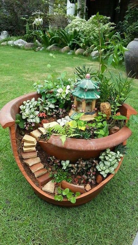 Broken pots can become enchanting little worlds right in your backyard. Just think of how a tiny gazebo, some charming rock stairs, and a few colorful plants can breathe life into those shards. You’ll find joy in crafting these whimsical spaces that spark imagination and invite playful spirits to visit. Fairy Garden Flower Pot, Fairy Garden Box, Broken Pot Garden, Diy Fairy Garden Ideas, Miniature Garden Design, Mini Succulent Garden, Fairy Garden Flowers, Fairy Garden Pots, Diy Fairy Garden